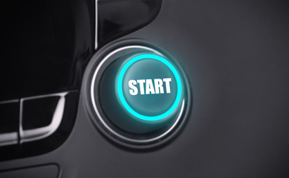 Image of Start button on dashboard in car, closeup