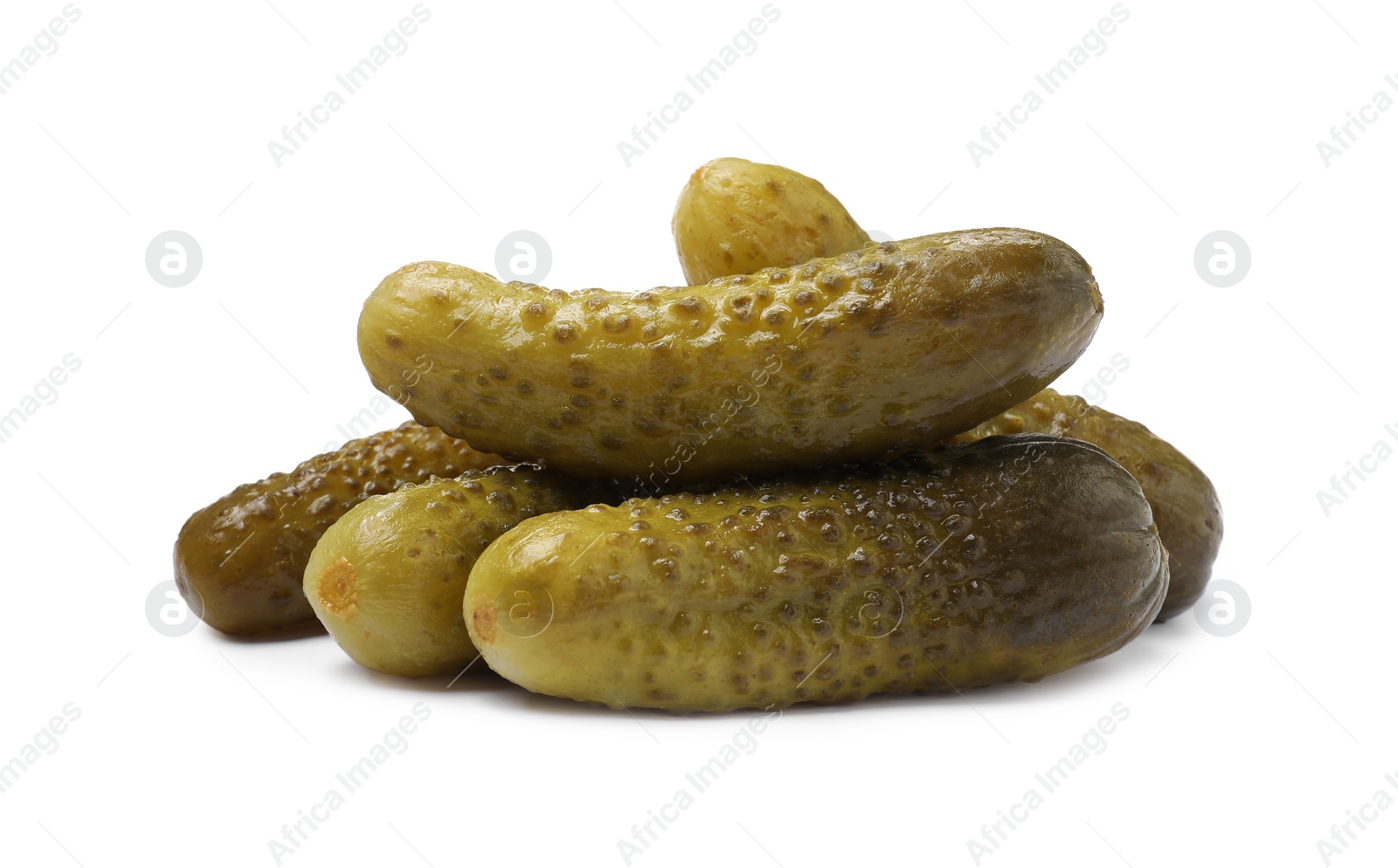Photo of Pile of tasty pickled cucumbers isolated on white