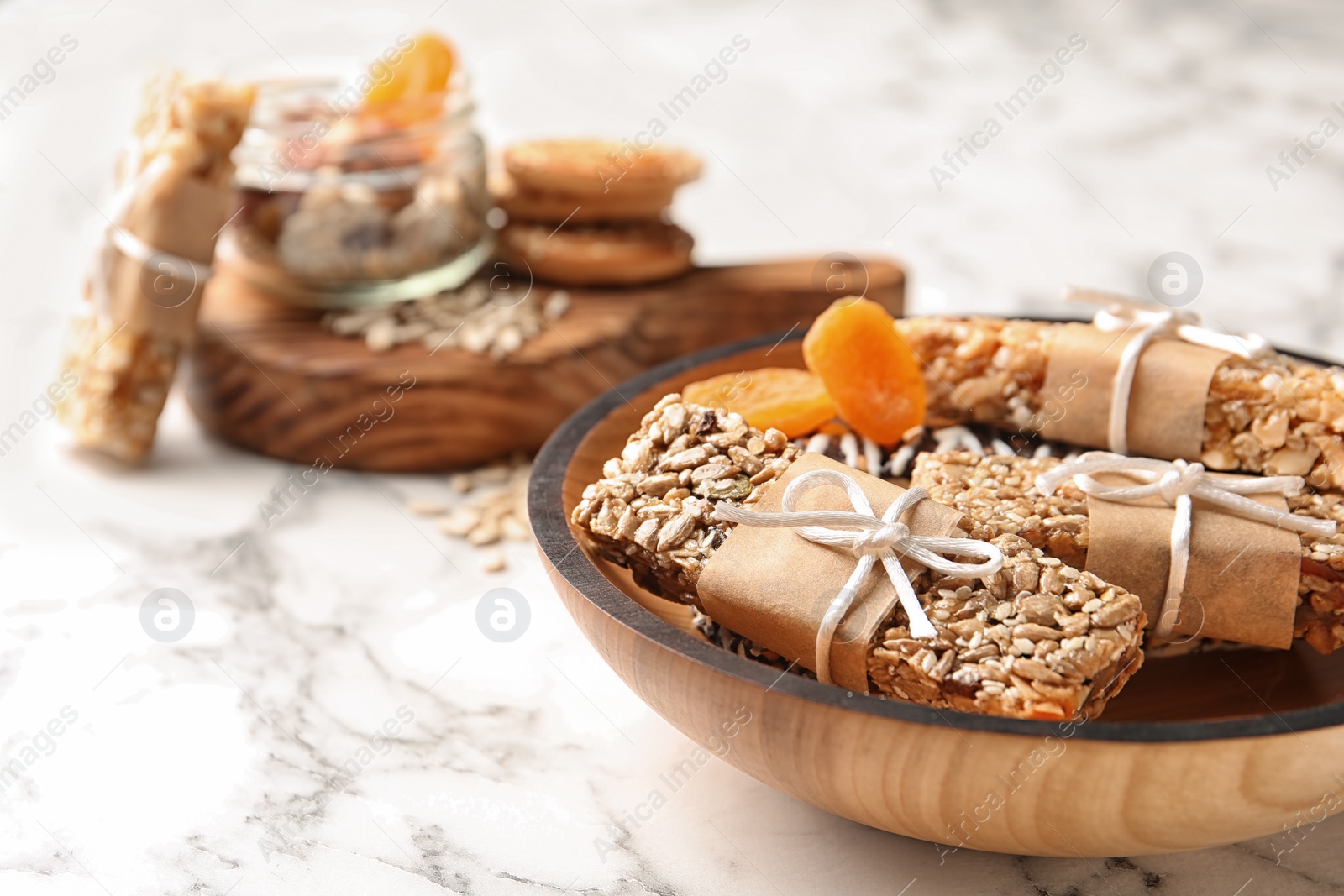 Photo of Homemade grain cereal bars on plate, closeup. Healthy snack