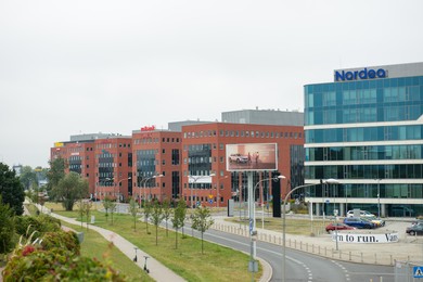Warsaw, Poland - September 10, 2022: Buildings with many modern logos outdoors