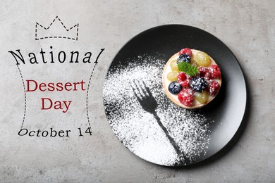 Image of National Dessert Day, October 14. Delicious tartlet with berries on light grey table, top view