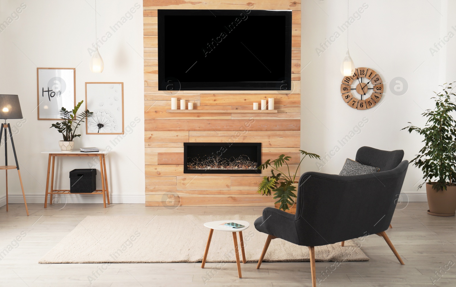 Photo of Living room interior with decorative fireplace in wooden wall