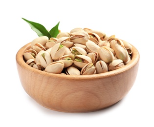Photo of Organic pistachio nuts and leaves in wooden bowl isolated on white