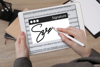 Image of Electronic signature. Woman using stylus and tablet, closeup