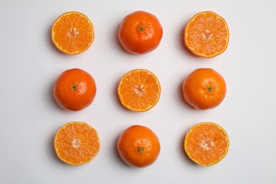 Delicious tangerines on white background, flat lay