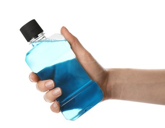 Photo of Woman holding bottle with mouthwash for teeth care on white background, closeup