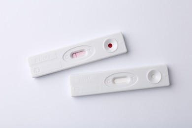 Photo of Two disposable express tests on white background, top view