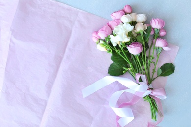 Bouquet of beautiful flowers on grey background, top view