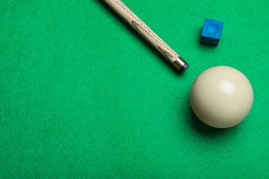Photo of Flat lay composition with ball and cue on billiard table, space for text