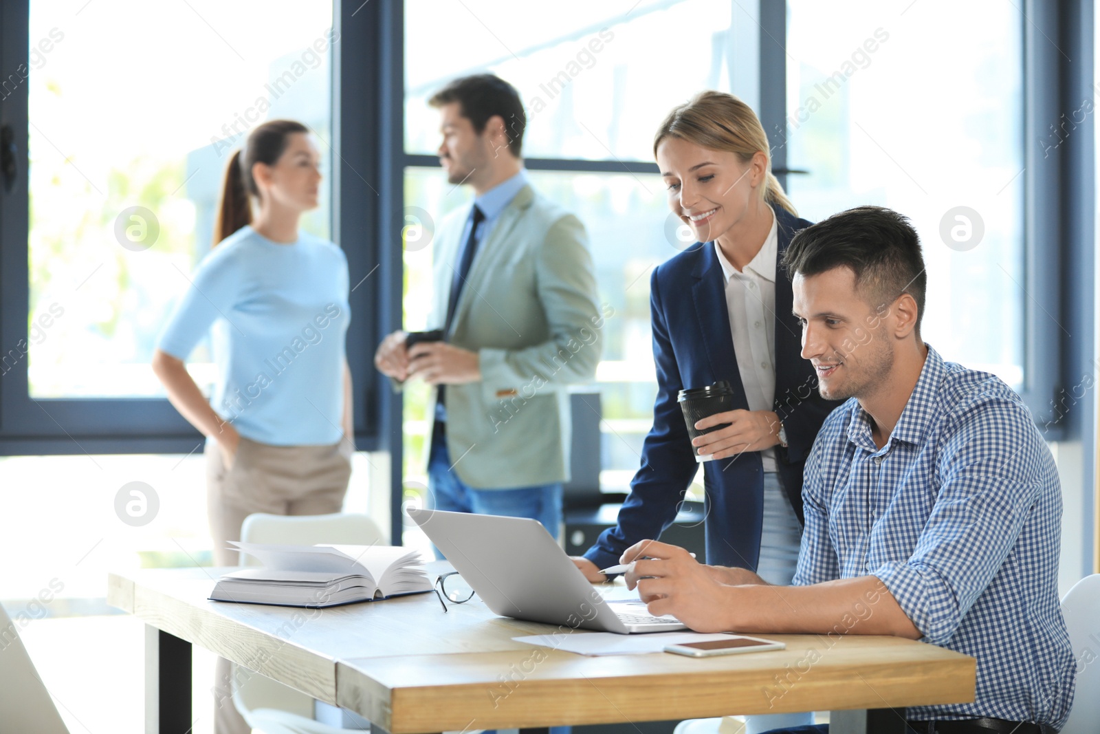 Photo of Office employees having business training at workplace