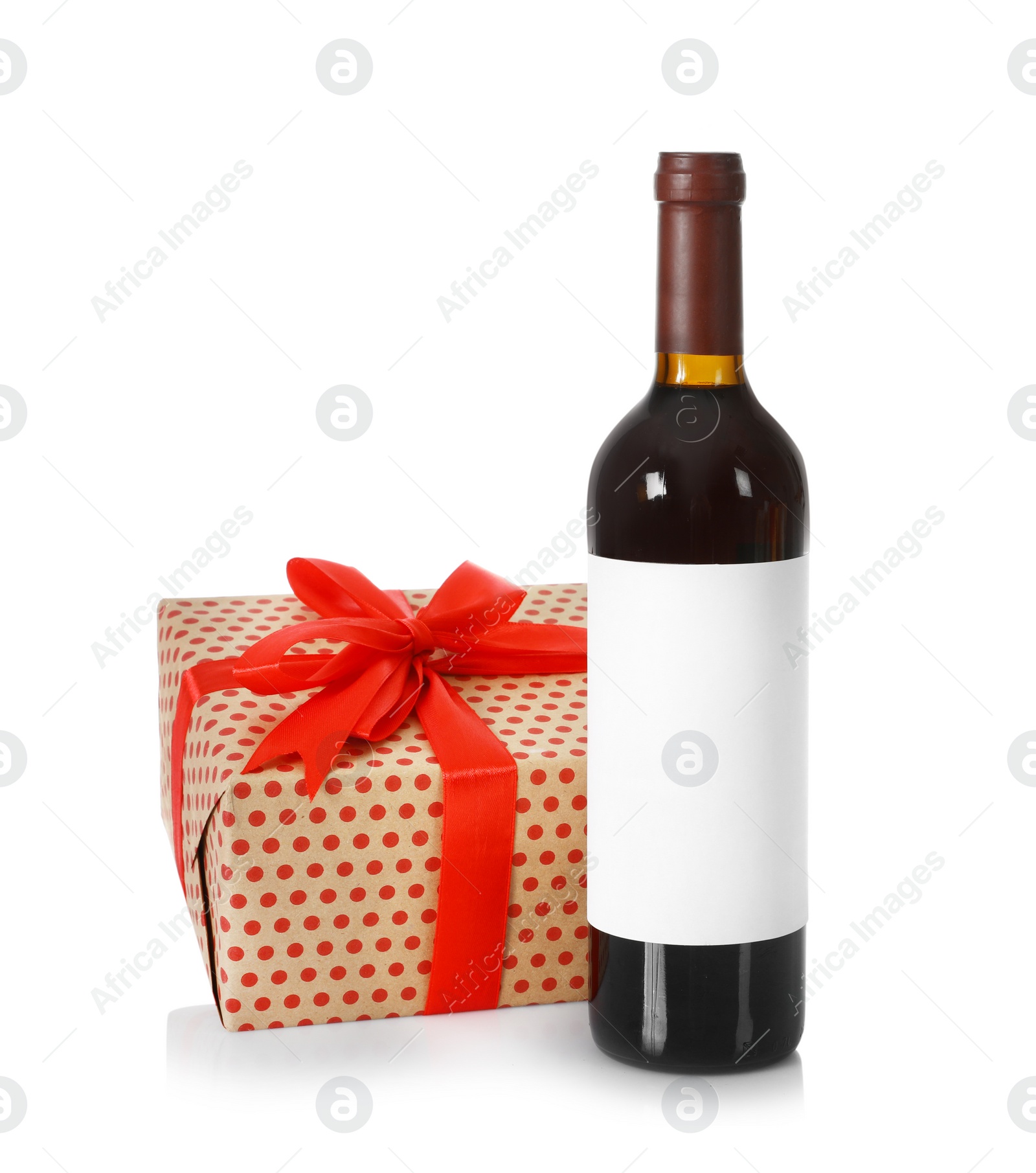 Photo of Bottle of wine and gift box on white background