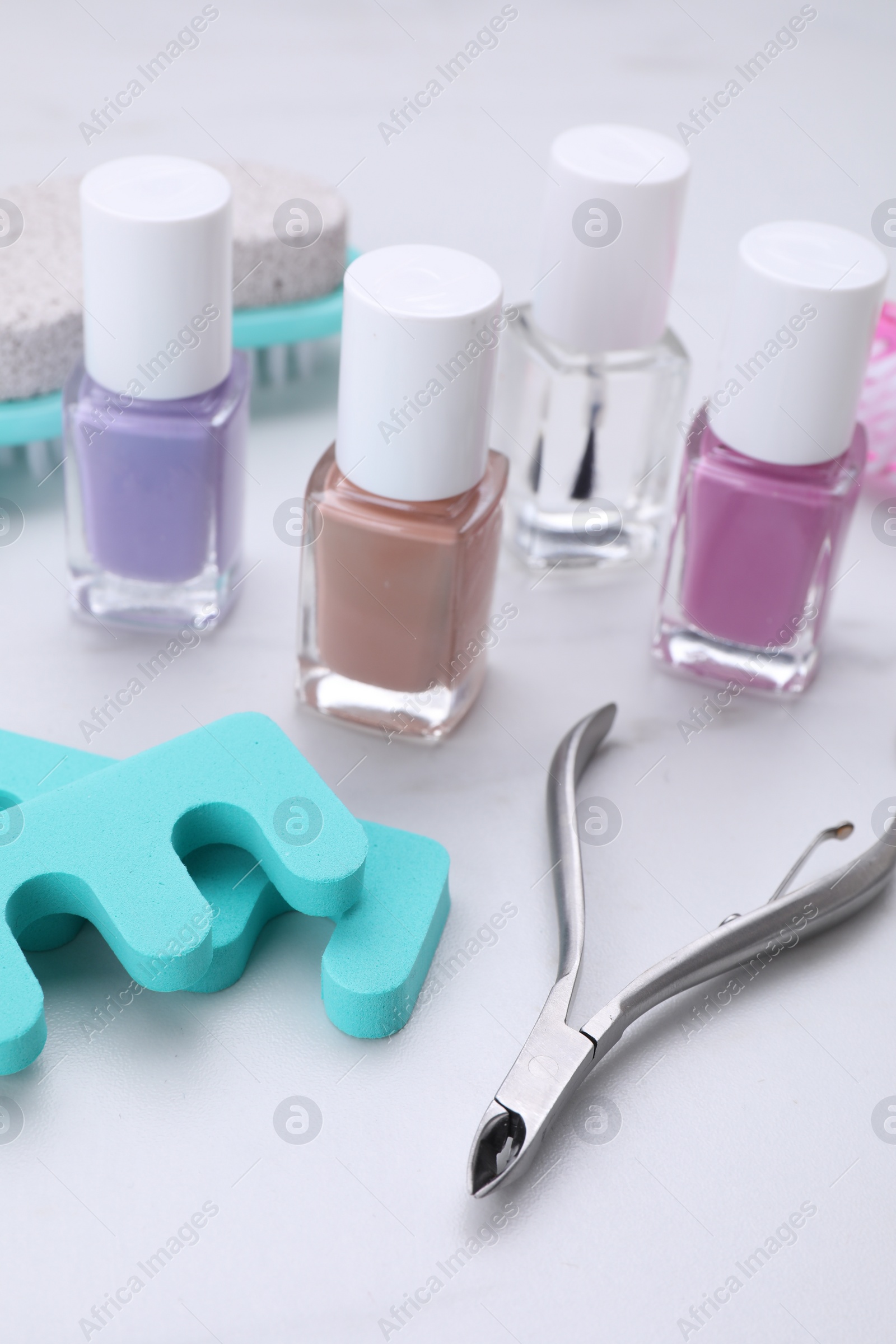 Photo of Set of pedicure tools on white table