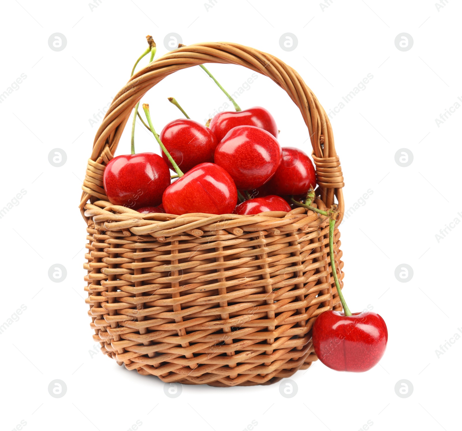 Photo of Wicker basket with ripe sweet cherries on white background