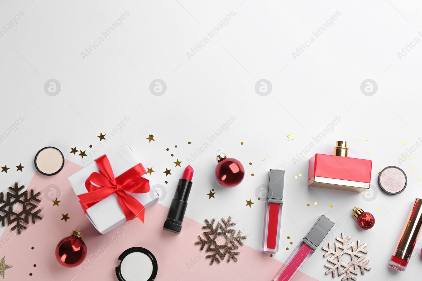 Photo of Flat lay composition with decorative cosmetic products on color background, space for text. Winter care