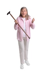 Photo of Angry senior woman with walking cane on white background
