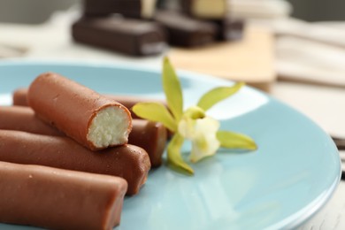 Photo of Glazed vanilla curd cheese bars served on table, closeup