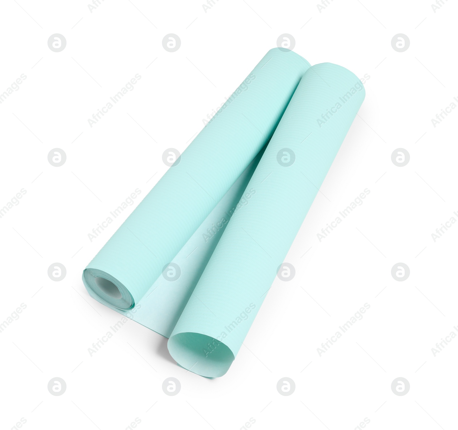 Photo of One light turquoise wallpaper roll isolated on white, top view