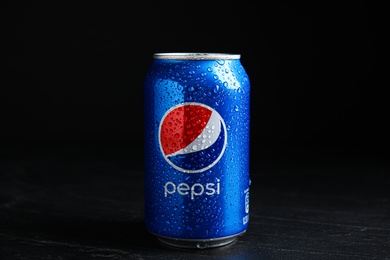 Photo of MYKOLAIV, UKRAINE - FEBRUARY 08, 2021: Can of Pepsi with water drops on black table