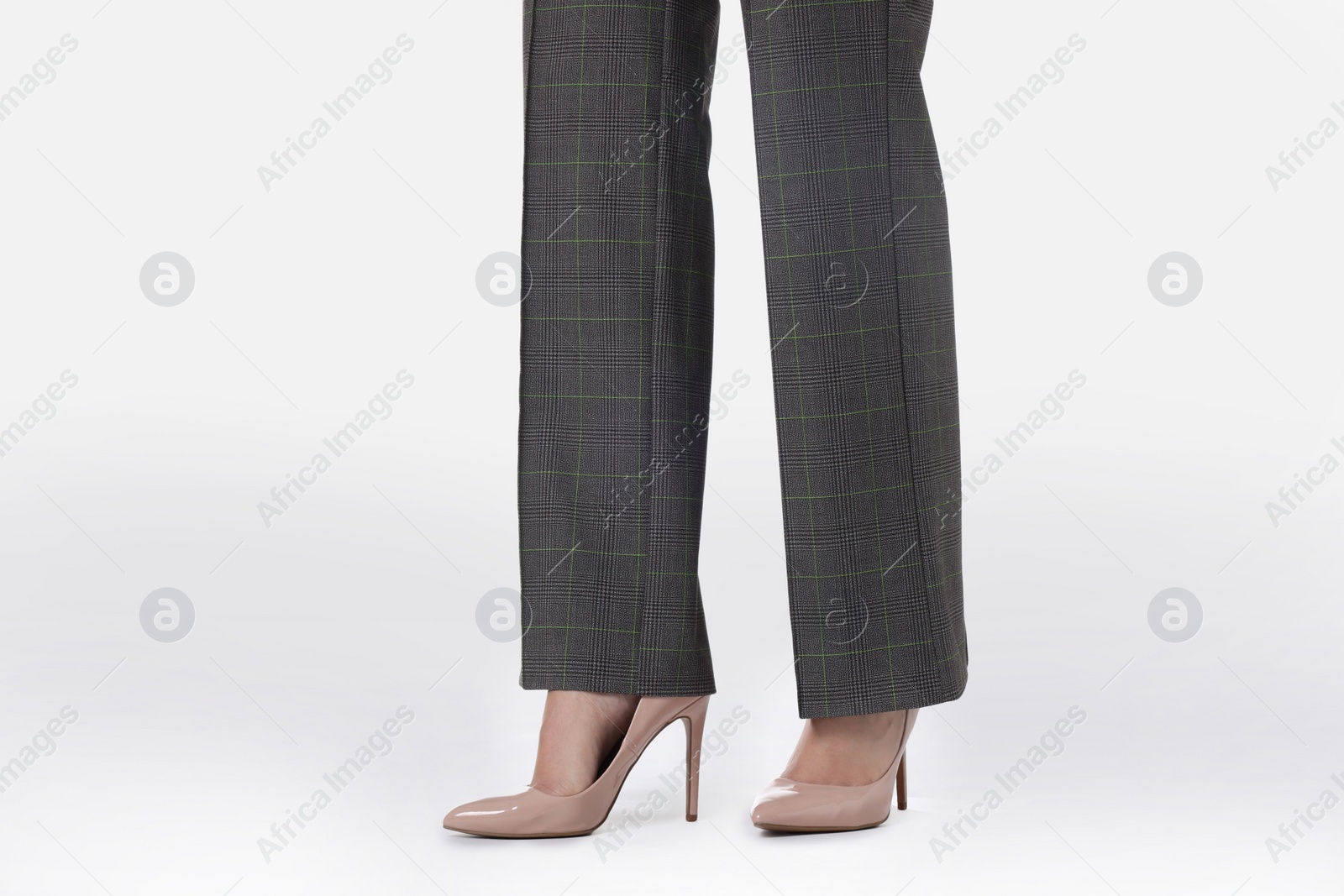 Photo of Businesswoman in beige shoes on white background, closeup