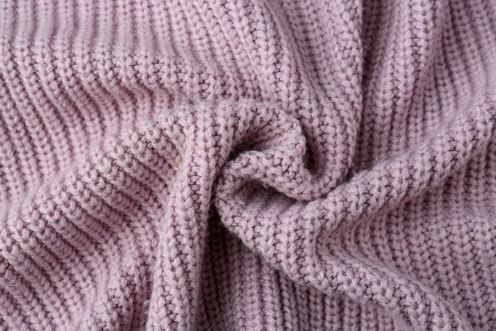 Photo of Beautiful violet knitted fabric as background, top view