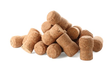 Heap of sparkling wine corks on white background