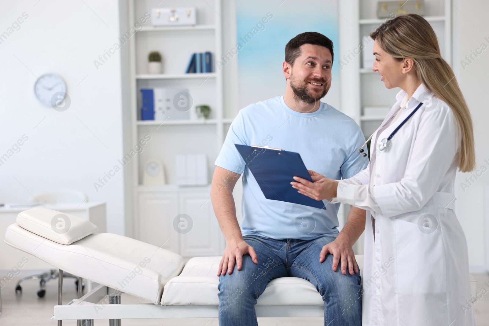 Photo of Professional doctor working with patient in hospital, space for text