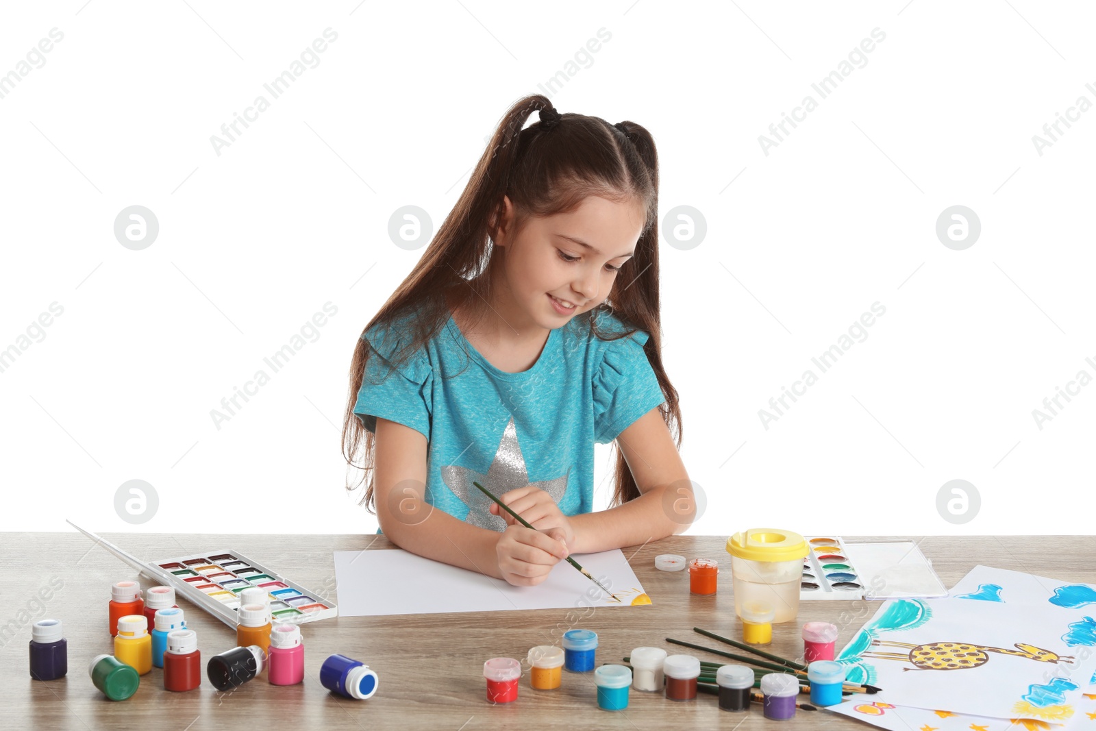 Photo of Cute child painting picture at table on white background