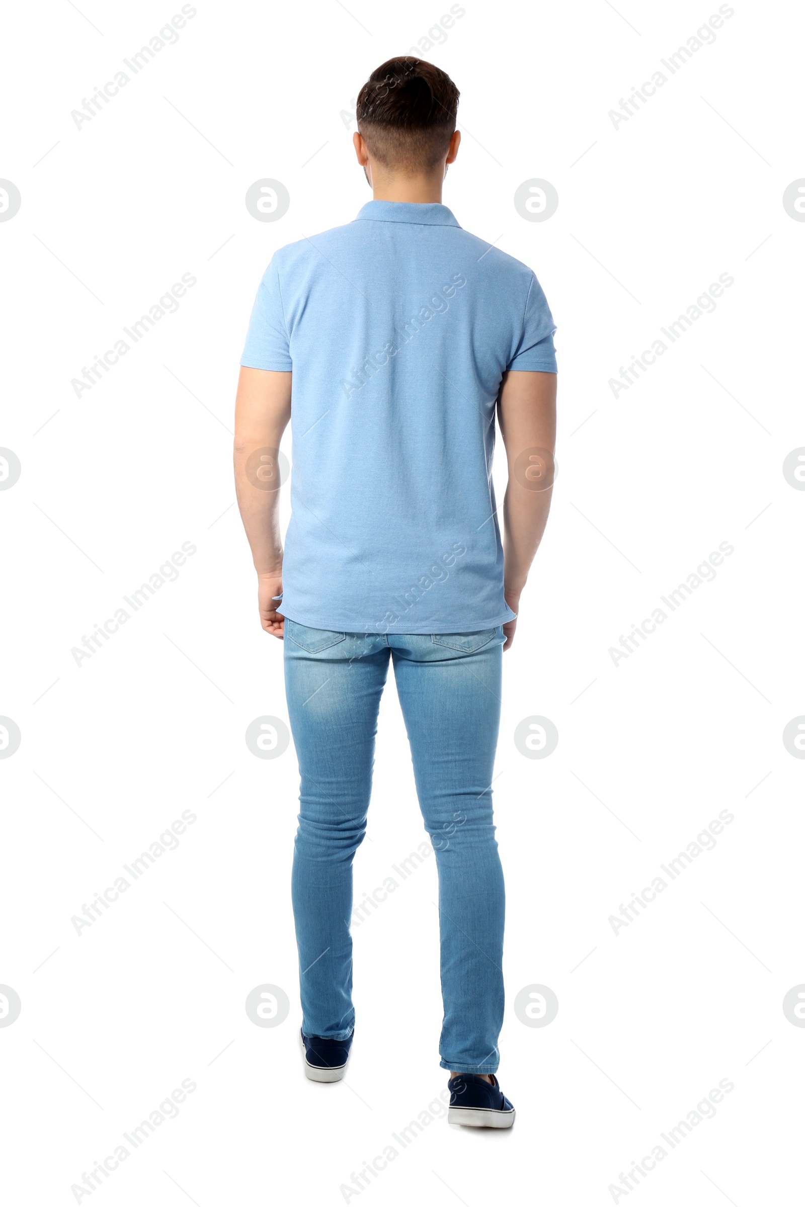 Photo of Young man in casual clothes posing on white background