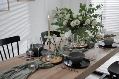 Photo of Festive table setting with beautiful tableware and decor indoors