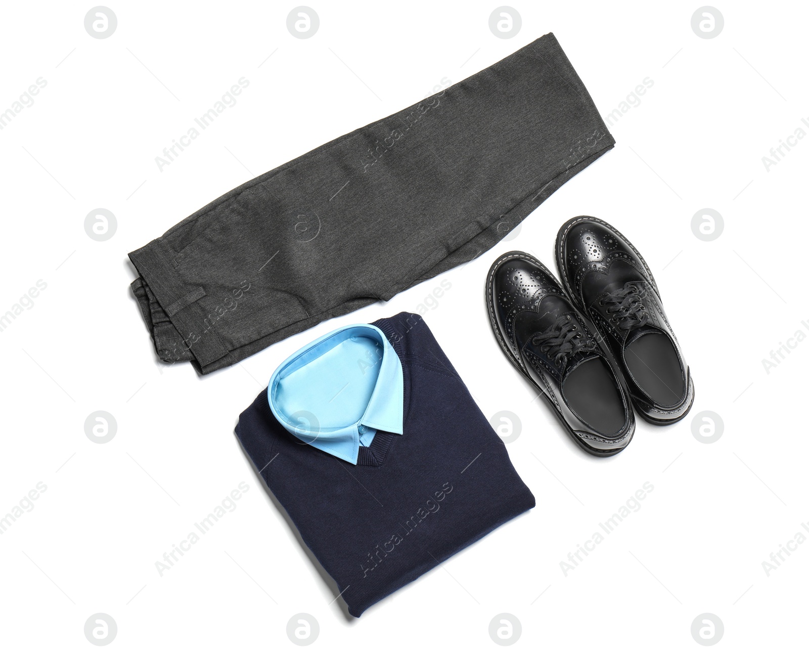 Photo of School uniform for boy on white background, top view