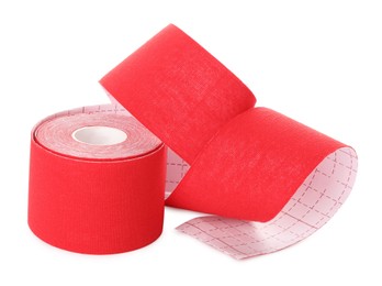Photo of Red kinesio tape in roll on white background