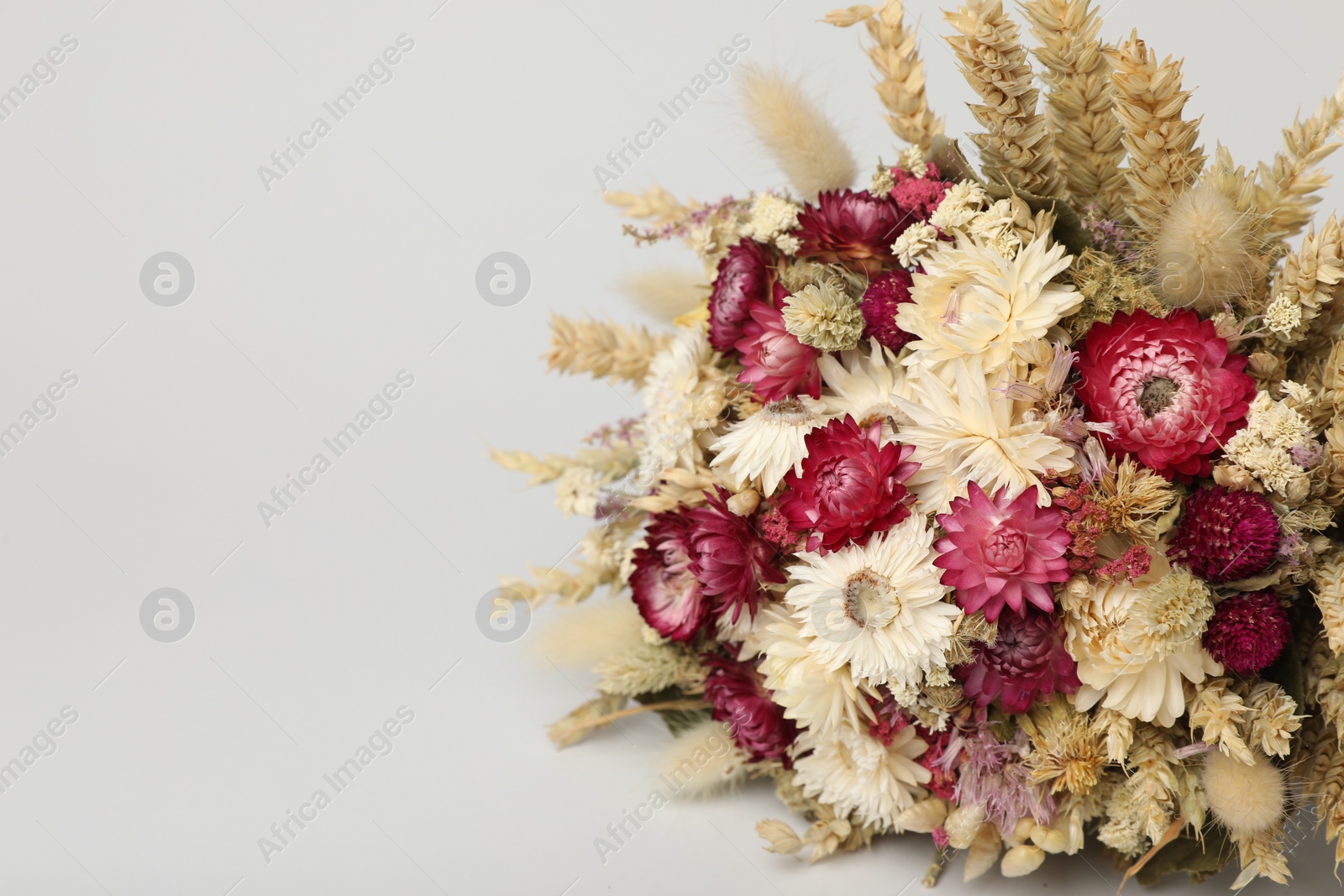 Photo of Beautiful bouquet of dry flowers on white background, space for text