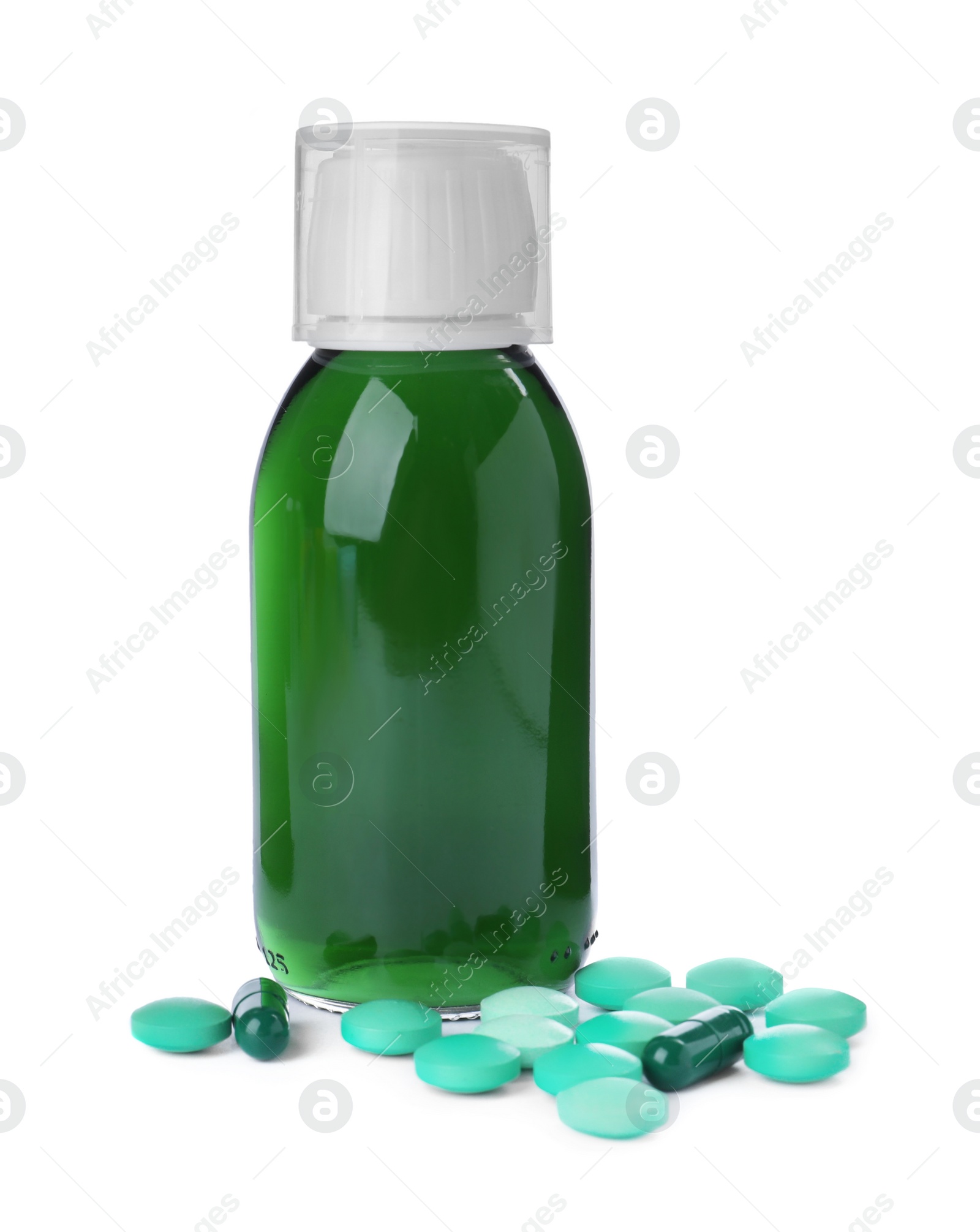 Photo of Bottle of syrup, measuring cup with pills on white background. Cough and cold medicine