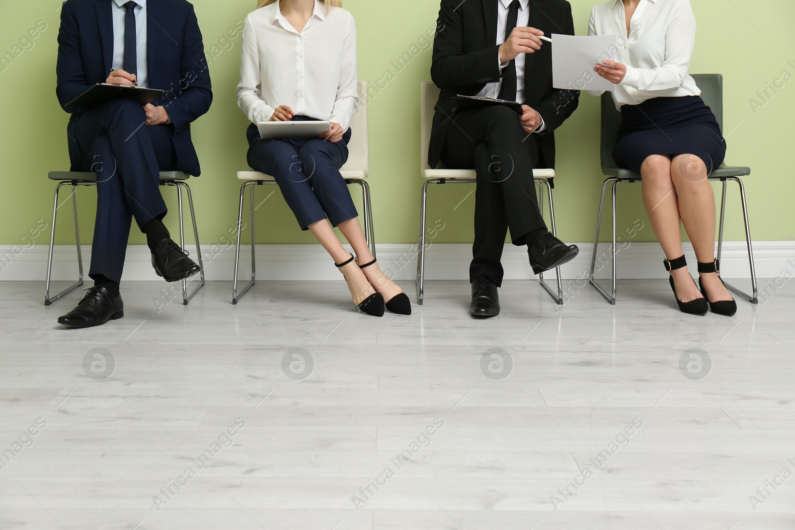 Photo of People waiting for job interview indoors, closeup