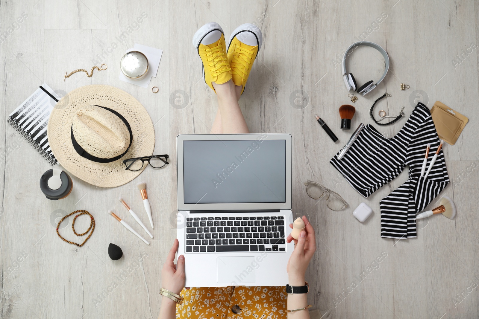 Photo of Beauty blogger with laptop on floor, top view