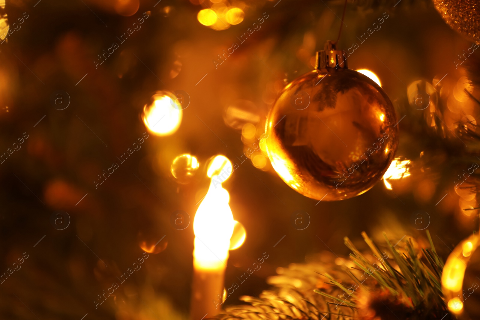 Photo of Closeup view of beautifully decorated Christmas tree indoors