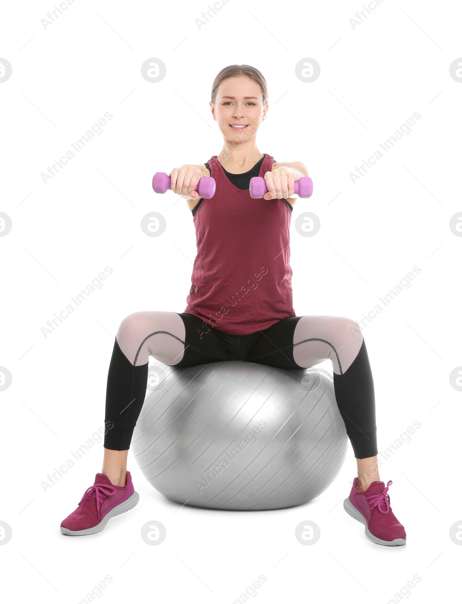 Photo of Young woman doing sports exercises isolated on white. Home fitness