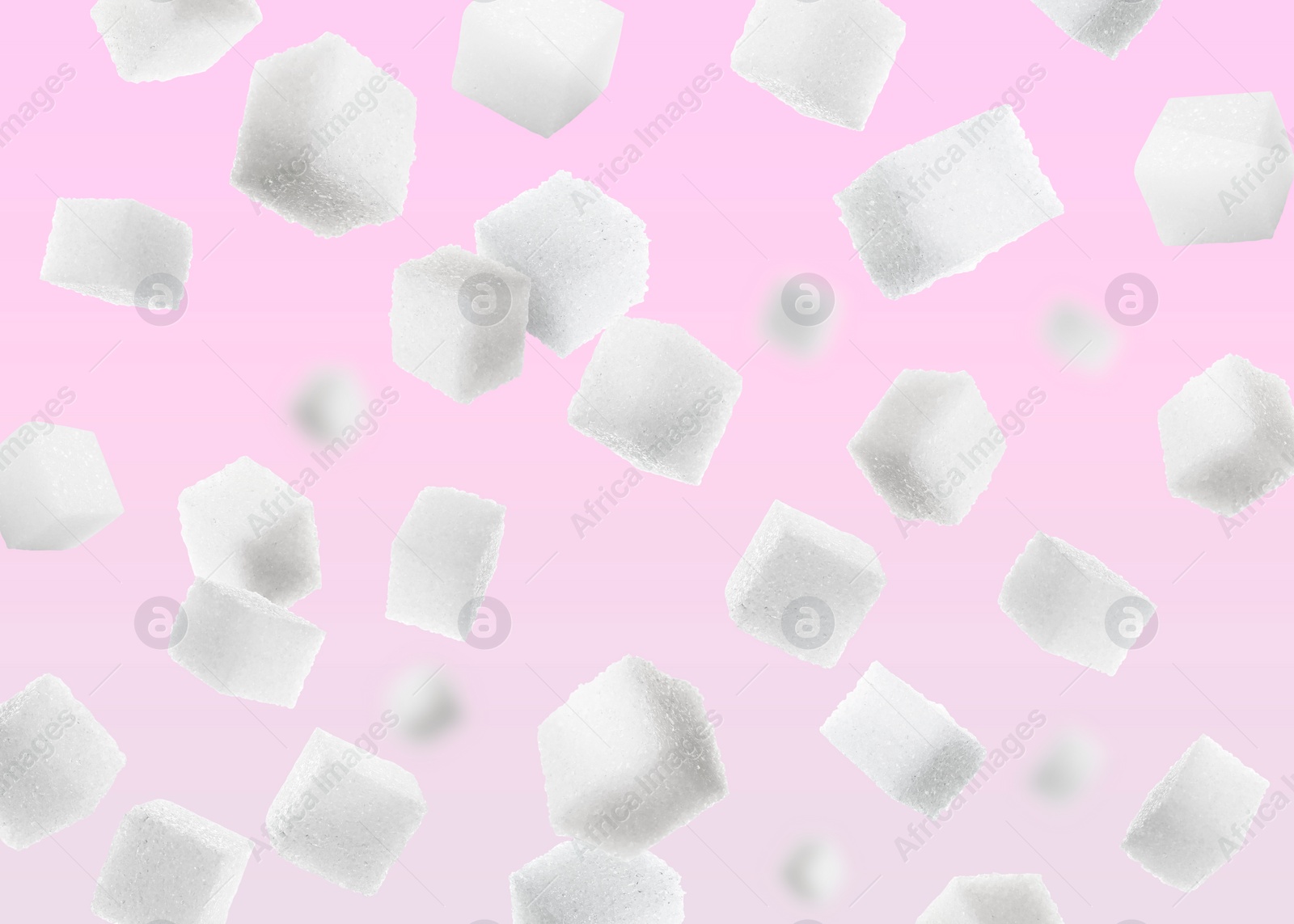 Image of Refined sugar cubes in air on pink background