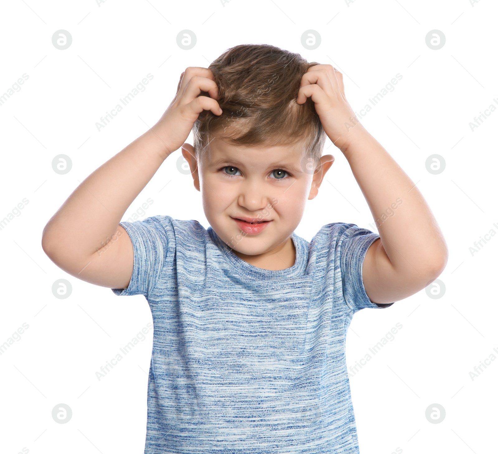 Photo of Little boy scratching head on white background. Annoying itch