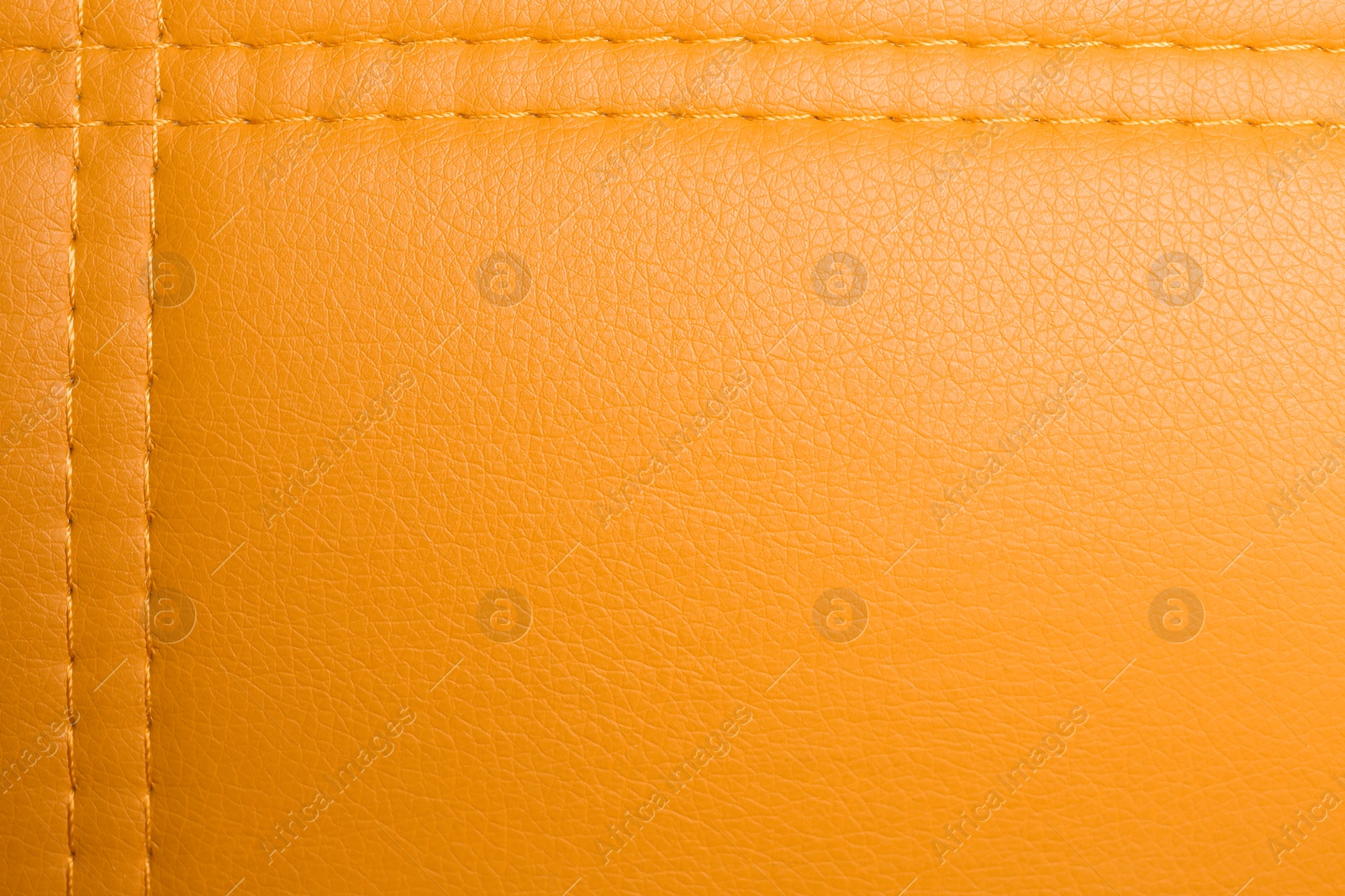 Photo of Texture of orange leather as background, top view