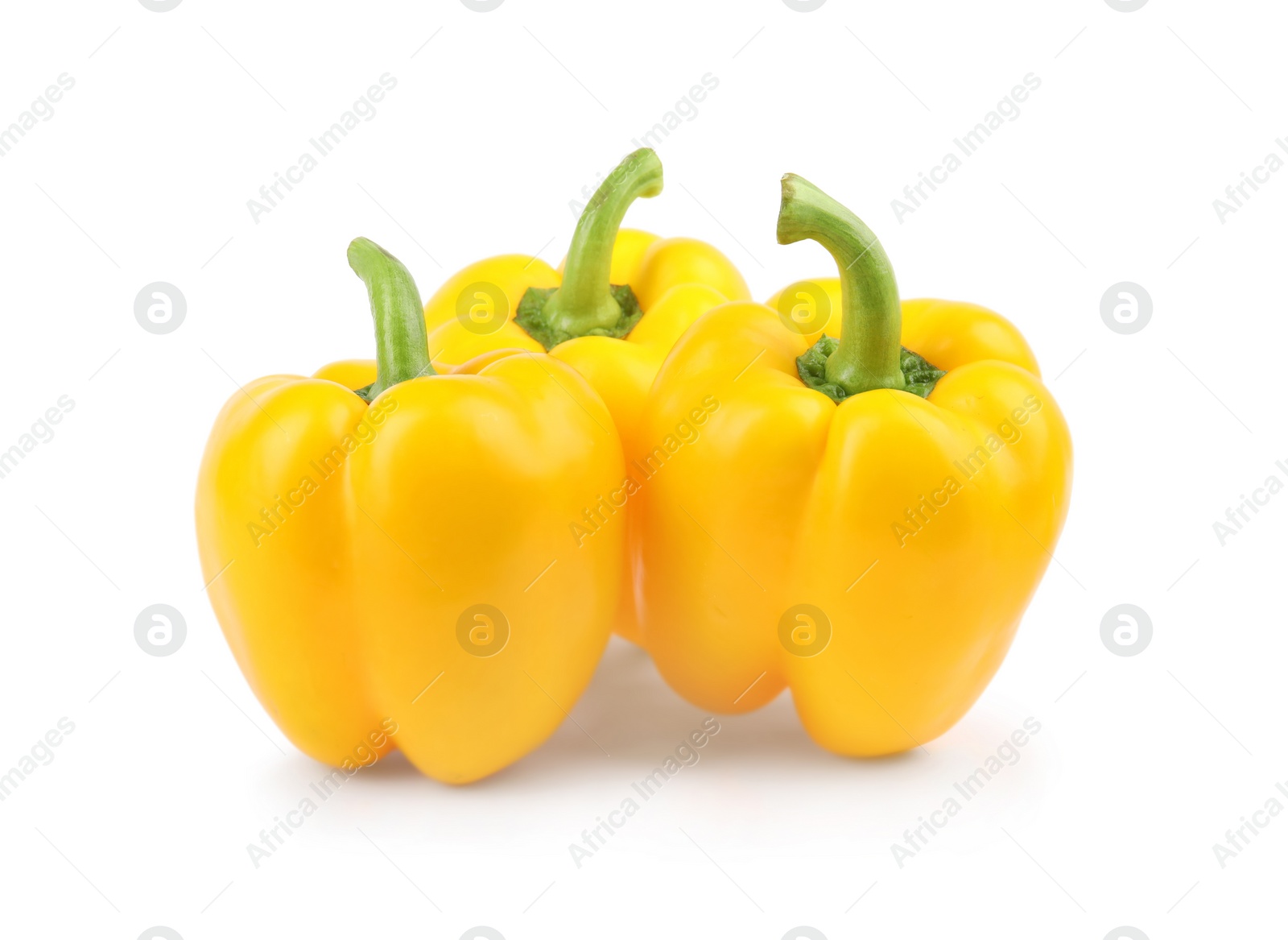 Photo of Ripe yellow bell peppers isolated on white