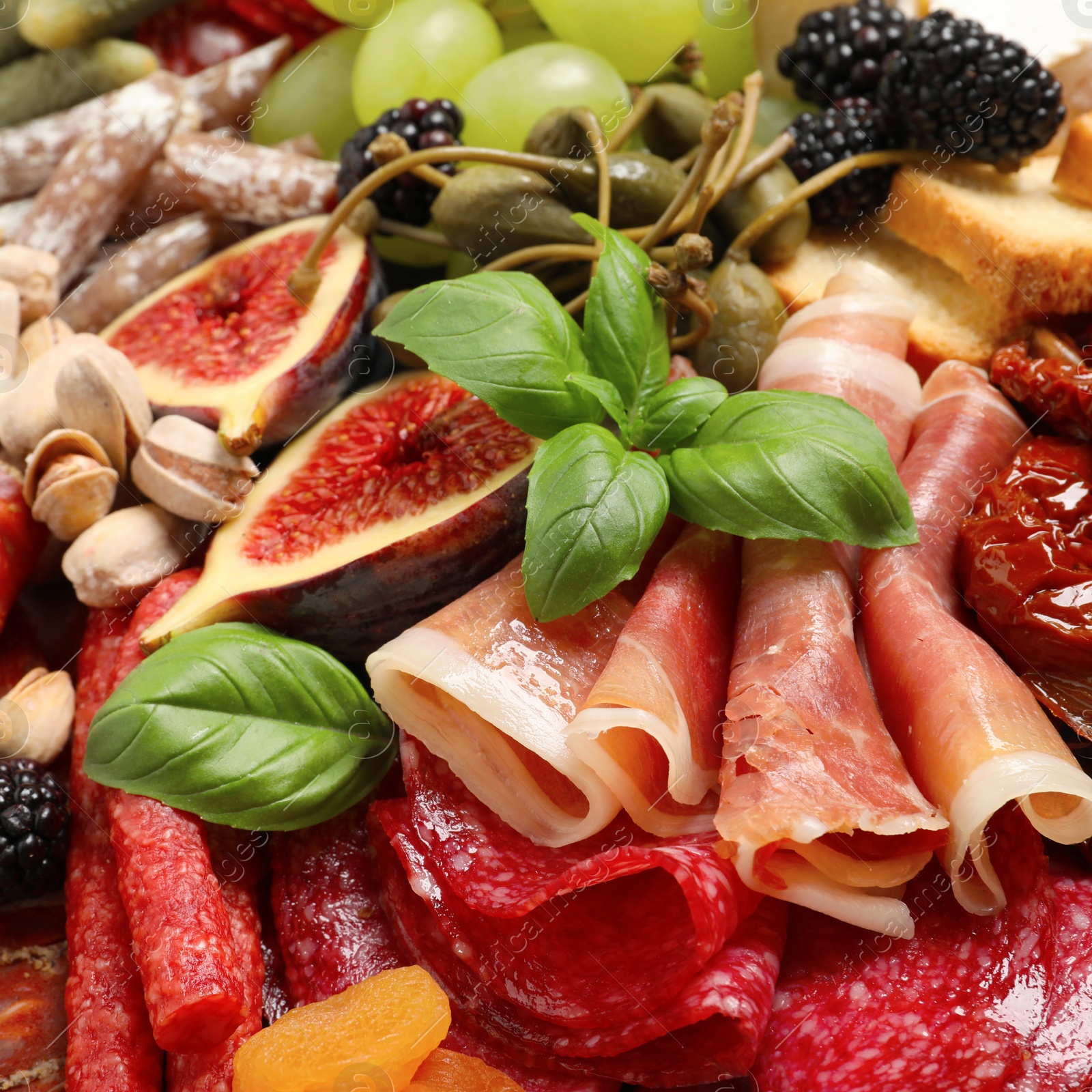 Photo of Set of different delicious appetizers as background, closeup