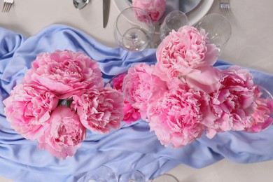 Photo of Stylish table setting with beautiful peonies, flat lay