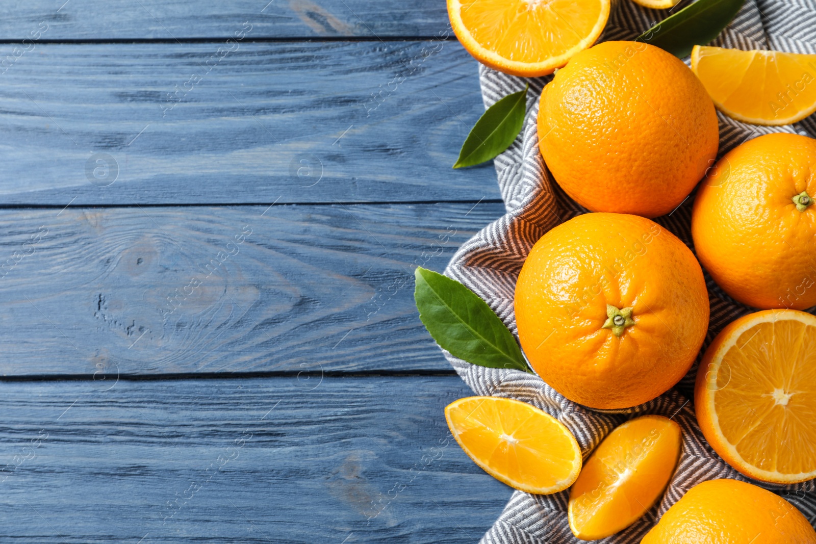 Photo of Flat lay composition with ripe oranges and space for text on wooden background