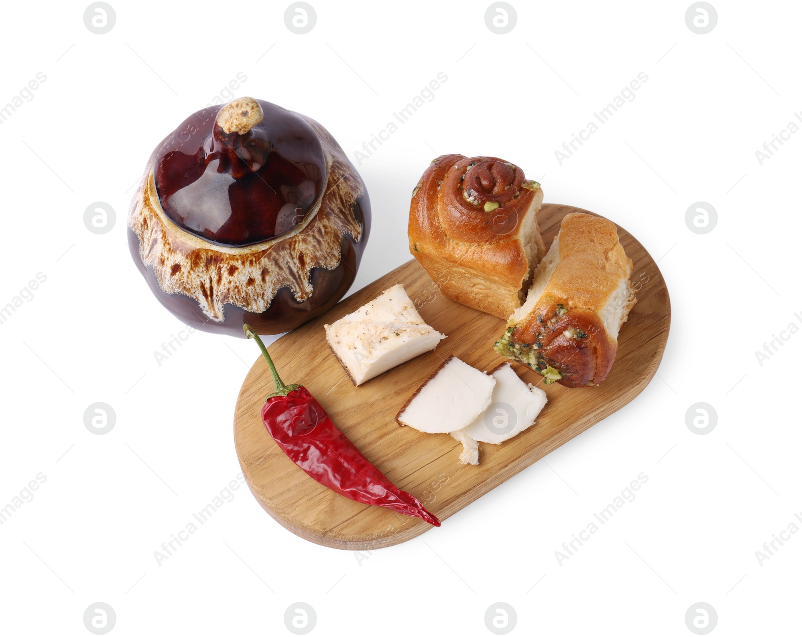 Photo of Delicious pampushky (buns), salo and pepper served for borsch isolated on white