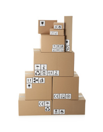 Stack of cardboard boxes with different packaging symbols on white background. Parcel delivery