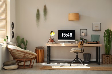 Photo of Room interior with comfortable workplace. Modern computer on wooden desk