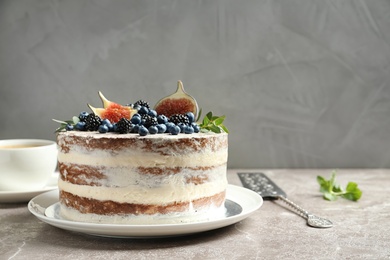 Photo of Delicious homemade cake with fresh berries on table. Space for text