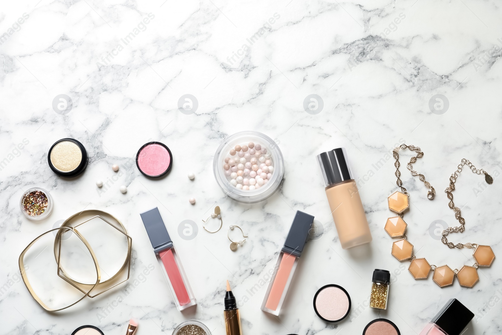 Photo of Beautiful composition with lipsticks and bijouterie on light background, flat lay