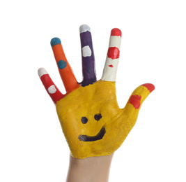 Kid with smiling face drawn on palm against white background, closeup